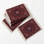 Three decorative rugs with intricate patterns and fringes on a white background